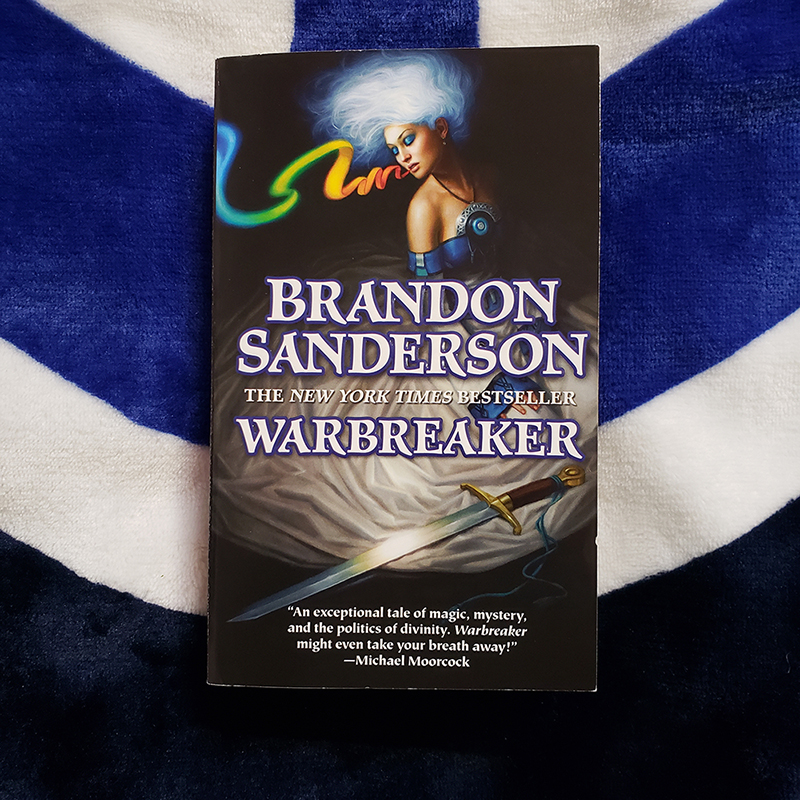Warbreaker novel on top of Bridge Four blanket