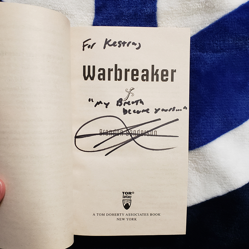 Warbreaker novel interior signed "For Kestra" by Brandon Sanderson